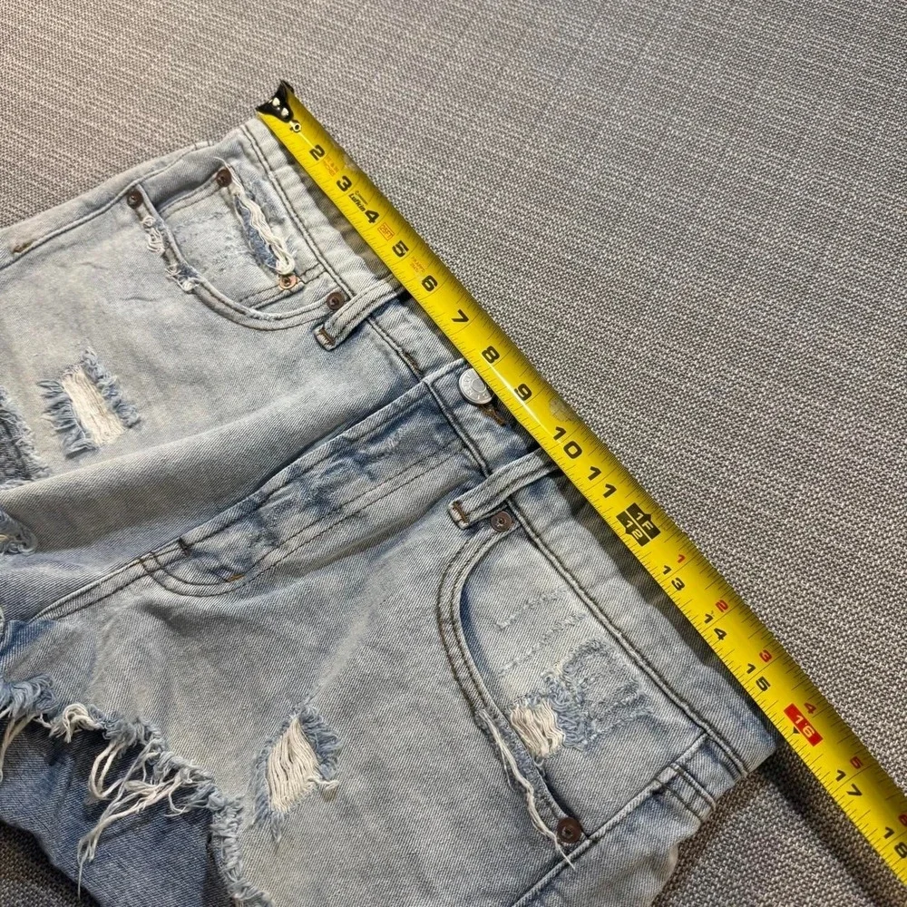 BDG Distressed blue denim shorts with frayed hem